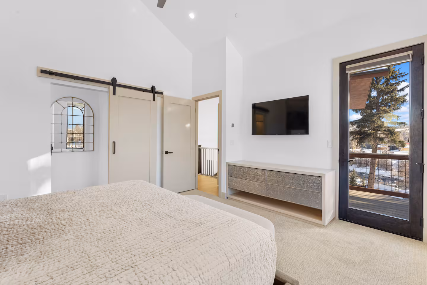 Queen bedroom with patio door
